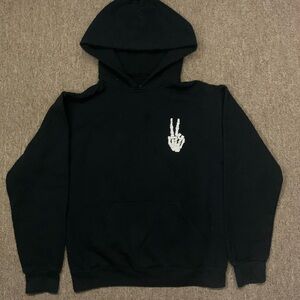 Black Hoodie with Skeleton Hand Graphic